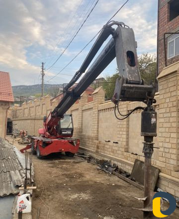 Телескопический погрузчик,бур