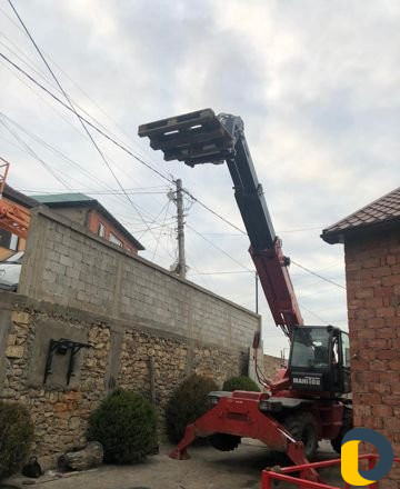 Телескопический вилочный погрузчик