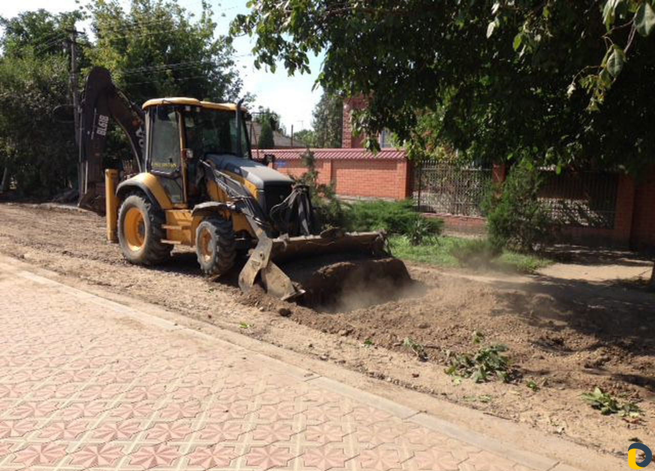 Услуги экскаватора-погрузчика