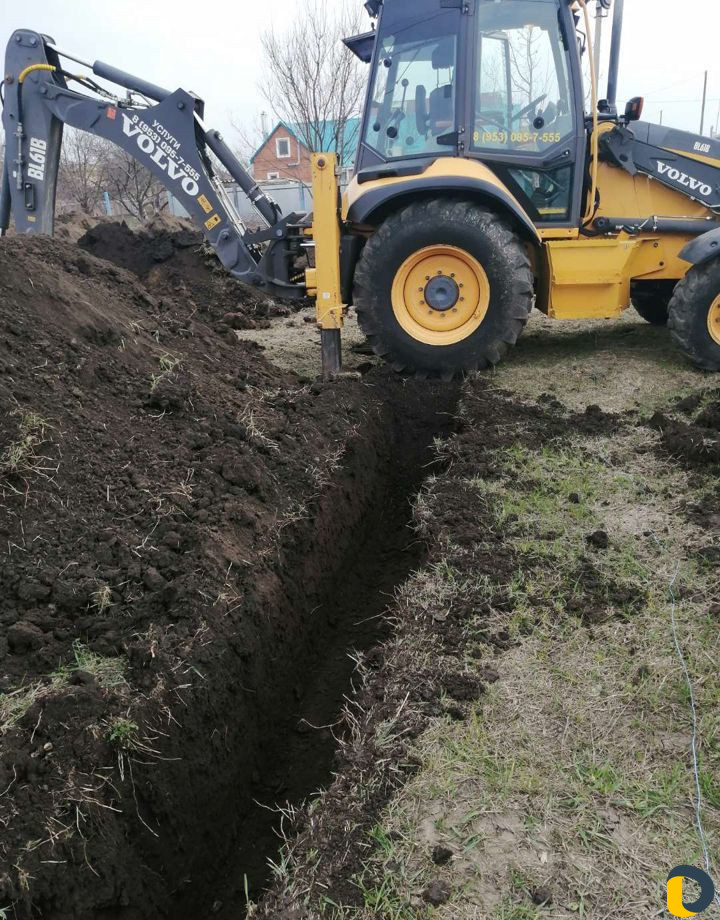 Услуги экскаватора-погрузчика