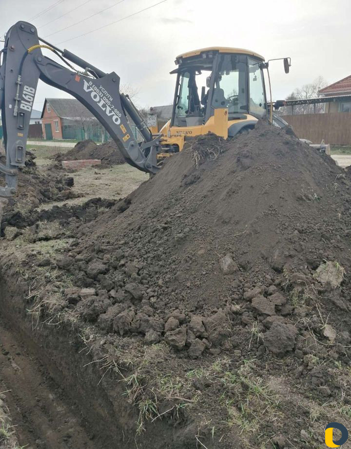 Услуги экскаватора-погрузчика